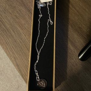 Stainless steel boob/heart necklace